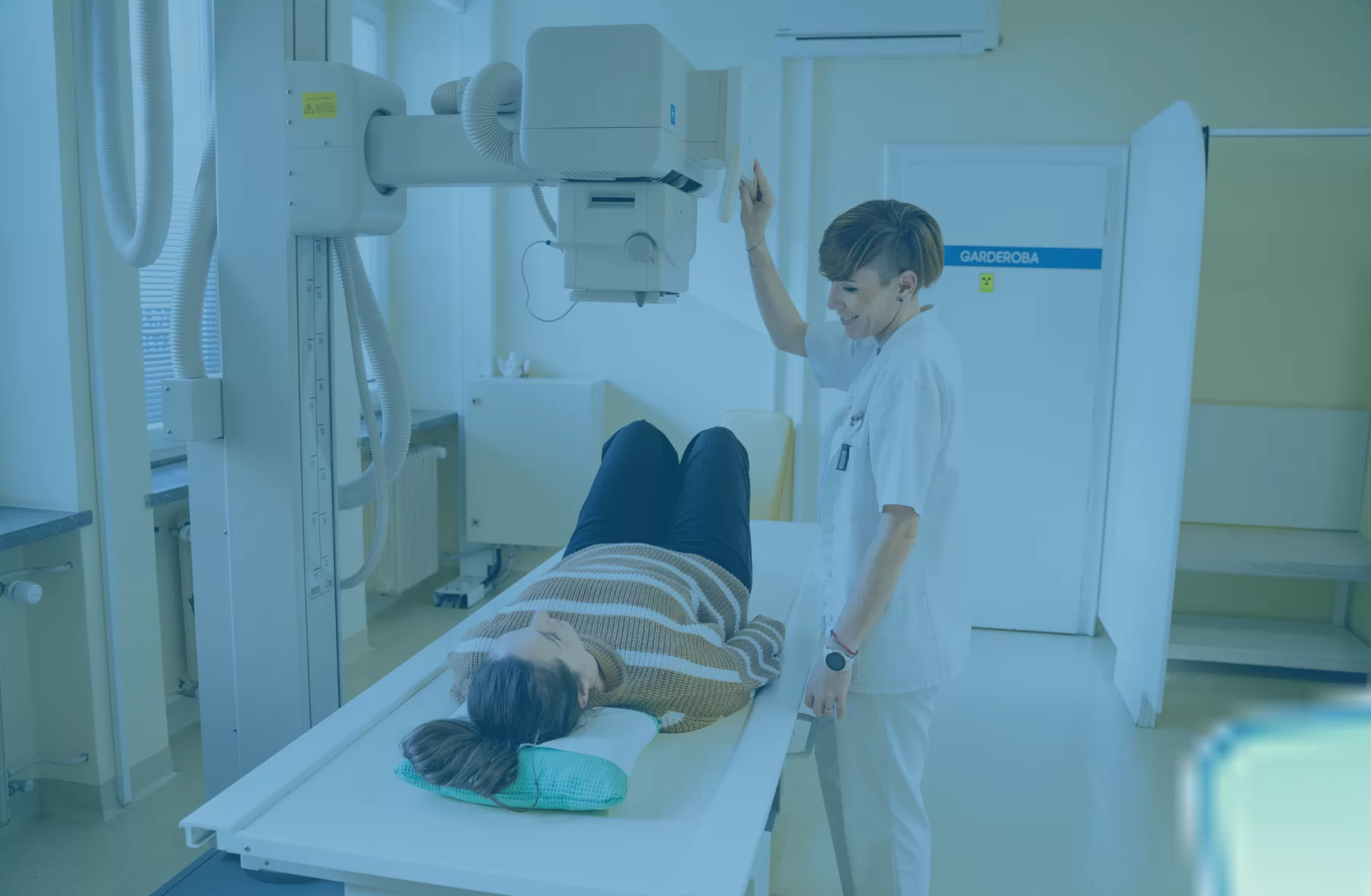 Medical professional performing an x-ray procedure